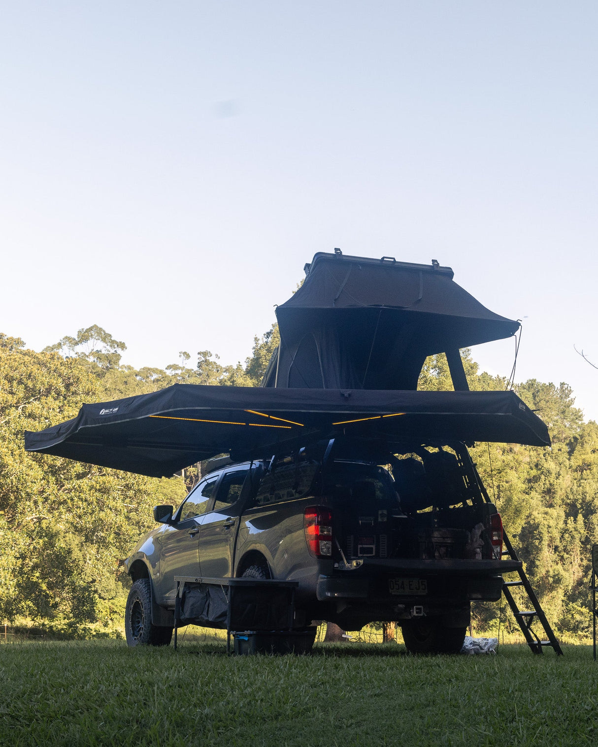 Quick-release awning and rooftop tent deployed on a BT-50 at camp
